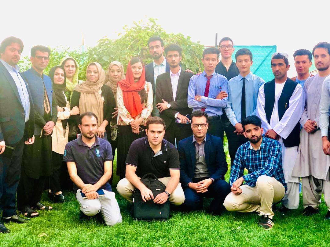 NYCP youth representatives gathered outdoors for a group photo